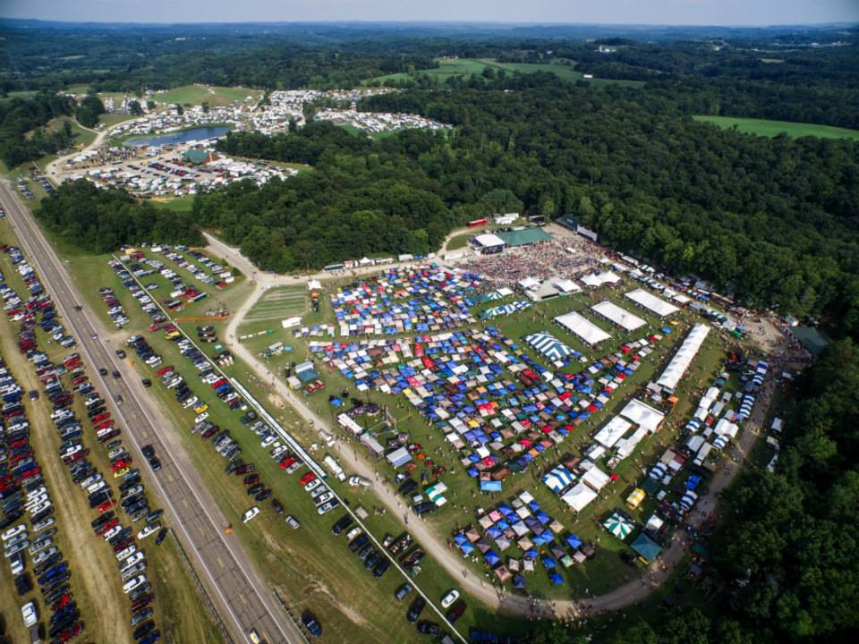 Aerial view of the Deerassic Classic grounds packed with vendor tents and parked cars