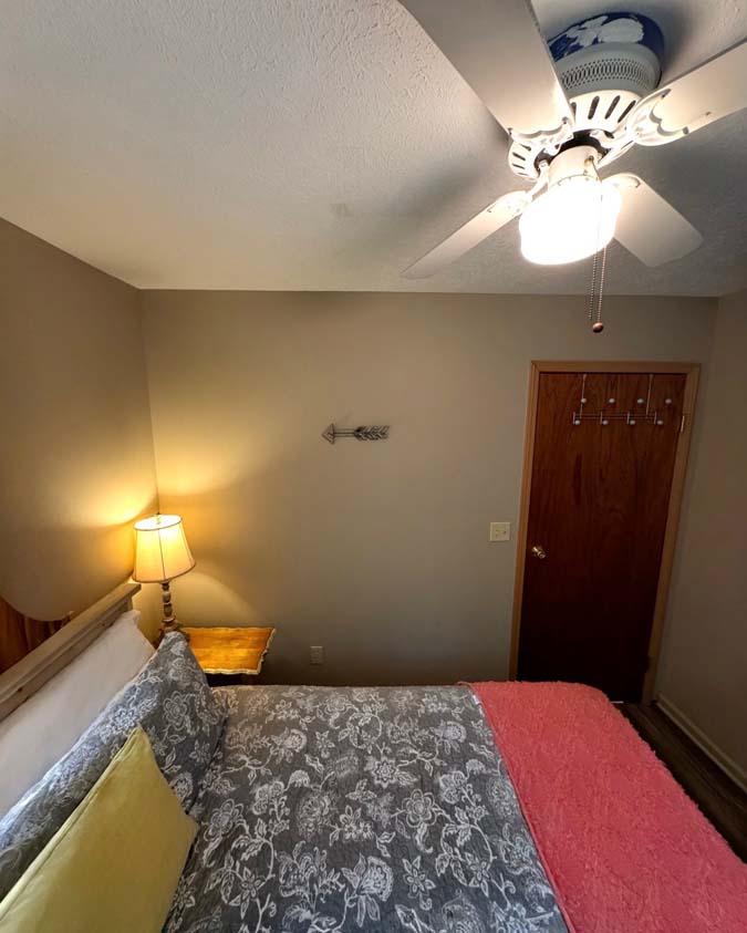 The Dogwood at Timberline Cabins bedroom, red blanket