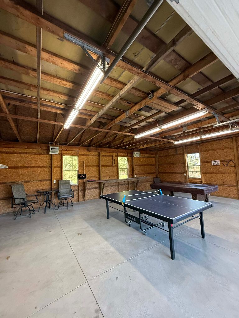 Game room with ping pong and pool tables