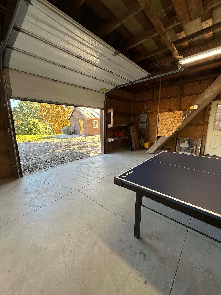 Game room garage door opening to the yard