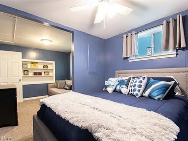 bedroom with blue walls and bedding