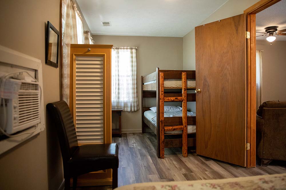 bedroom, brown chair, bunk beds